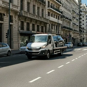Grúa remolcando un auto negro